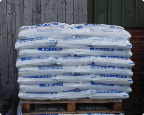 Small 25kg Bags of Brown De-icing rock salt on a pallet