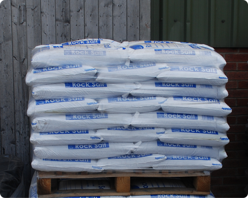 Small 25kg white de-icing salt bags on a pallet